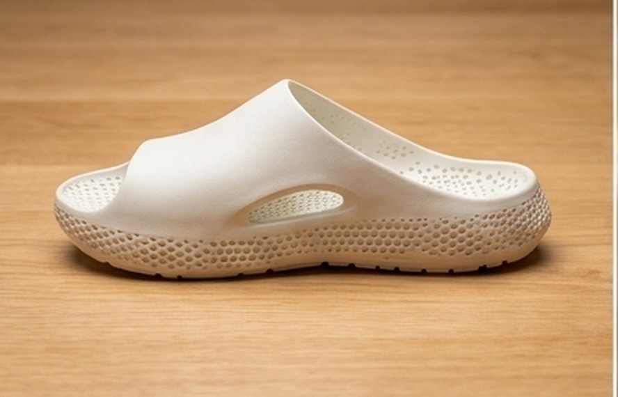 A finished 3D-printed sandal on a bench